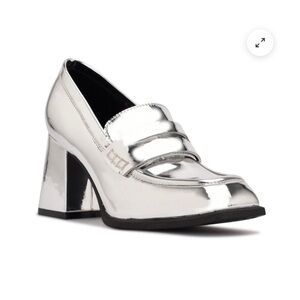 Silver block heeled loafer.